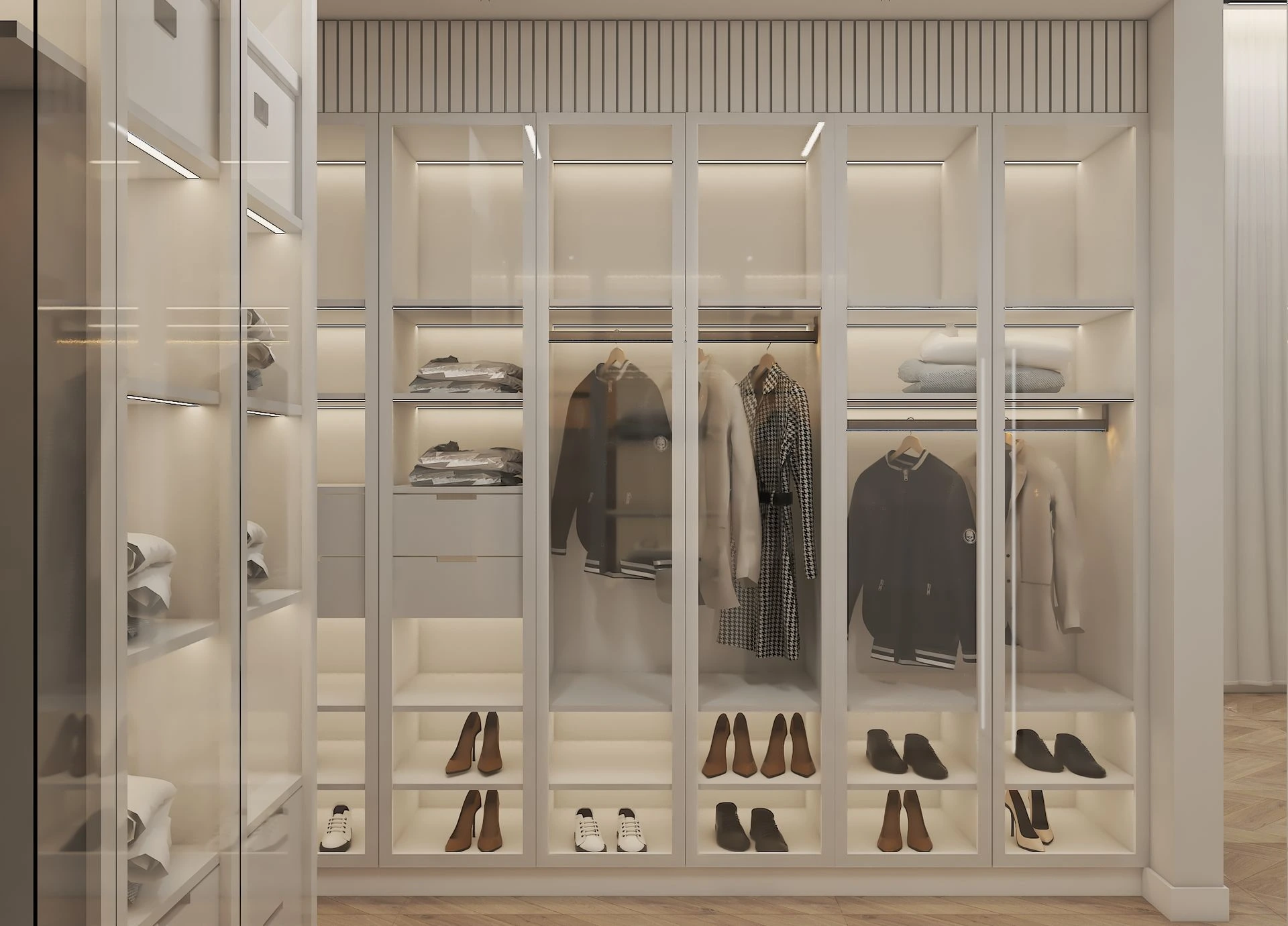 Glass-fronted wardrobes with lit shelves and shoe displays in a walk-in dressing room, Dubai